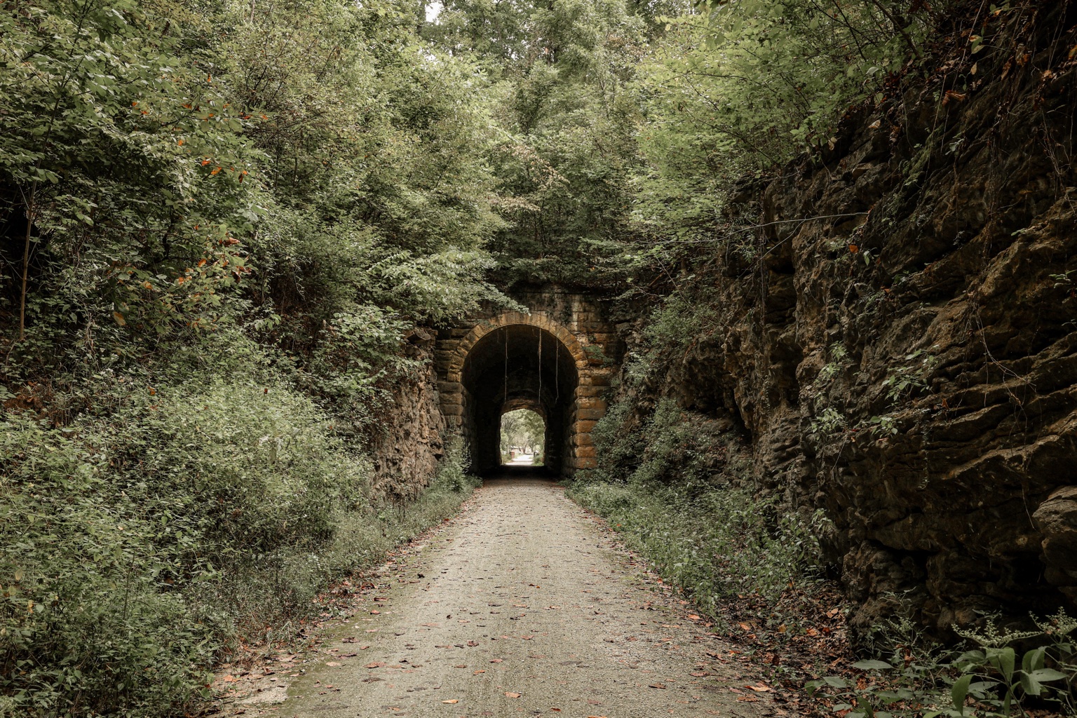 Tree-lined Katy Trail leading through the historic Rocheport tunnel in Missouri